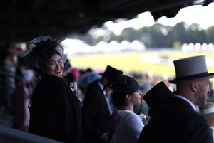 ASCOT, ENGLAND - JUNE 14: Racegoers drink Champagne during Day One of Royal Ascot 2022 at Ascot Racecourse on June 14, 2022 in Ascot, England. (Photo by Ryan Pierse/Getty Images)
