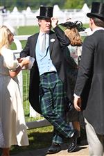 ASCOT, ENGLAND - JUNE 14: A racegoer tips their top hat during Royal Ascot 2022 at Ascot Racecourse on June 14, 2022 in Ascot, England. (Photo by Eamonn M. McCormack/Getty Images for Ascot Racecourse)