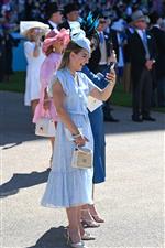 ASCOT, ENGLAND - JUNE 14: A racegoer films a bet winner during Royal Ascot 2022 at Ascot Racecourse on June 14, 2022 in Ascot, England. (Photo by Eamonn M. McCormack/Getty Images for Ascot Racecourse)