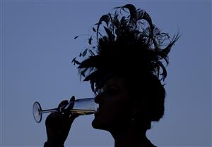 ASCOT, ENGLAND - JUNE 14: Racegoers drink Champagne during Day One of Royal Ascot 2022 at Ascot Racecourse on June 14, 2022 in Ascot, England. (Photo by Ryan Pierse/Getty Images)