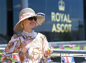 ASCOT, ENGLAND - JUNE 14: A racegoer attends Royal Ascot 2022 at Ascot Racecourse on June 14, 2022 in Ascot, England. (Photo by Eamonn M. McCormack/Getty Images for Ascot Racecourse)