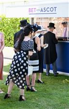 ASCOT, ENGLAND - JUNE 14: Guests placing bets during Royal Ascot 2022 at Ascot Racecourse on June 14, 2022 in Ascot, England. (Photo by Eamonn M. McCormack/Getty Images for Ascot Racecourse)