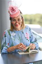 ASCOT, ENGLAND - JUNE 14: A racegoer attends Royal Ascot 2022 at Ascot Racecourse on June 14, 2022 in Ascot, England. (Photo by Eamonn M. McCormack/Getty Images for Ascot Racecourse)