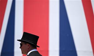 A race-goer arrives to attend the second day of the Royal Ascot horse racing meet, in Ascot, west of London on June 15, 2022. (Photo by JUSTIN TALLIS / AFP) (Photo by JUSTIN TALLIS/AFP via Getty Images)