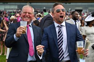 Race-goers cheer as they watch a race on the second day of the Royal Ascot horse racing meet, in Ascot, west of London on June 15, 2022. (Photo by JUSTIN TALLIS / AFP) (Photo by JUSTIN TALLIS/AFP via Getty Images)