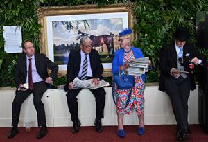 Race-goers attend the second day of the Royal Ascot horse racing meet, in Ascot, west of London on June 15, 2022. (Photo by JUSTIN TALLIS / AFP) (Photo by JUSTIN TALLIS/AFP via Getty Images)