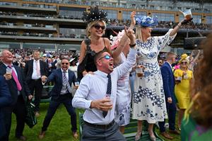 Race-goers cheer as they watch a race on the second day of the Royal Ascot horse racing meet, in Ascot, west of London on June 15, 2022. (Photo by JUSTIN TALLIS / AFP) (Photo by JUSTIN TALLIS/AFP via Getty Images)