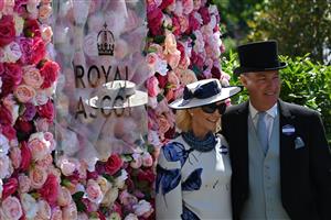 Race-goers attend the second day of the Royal Ascot horse racing meet, in Ascot, west of London on June 15, 2022. (Photo by JUSTIN TALLIS / AFP) (Photo by JUSTIN TALLIS/AFP via Getty Images)