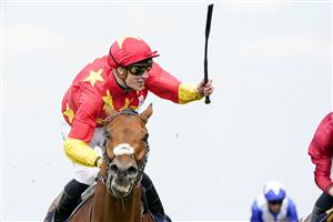 ASCOT, ENGLAND - JUNE 15: Shane Crosse celebrates as he rides State Of Rest to win The Prince Of Wales