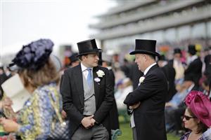 ASCOT, ENGLAND - JUNE 15: Racegoers chat during Royal Ascot 2022 at Ascot Racecourse on June 15, 2022 in Ascot, England. (Photo by John Phillips/Getty Images for Ascot Racecourse)
