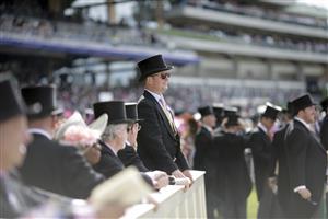 ASCOT, ENGLAND - JUNE 15: Racegoers watch a race from inside the Royal Enclosure during Royal Ascot 2022 at Ascot Racecourse on June 15, 2022 in Ascot, England. (Photo by John Phillips/Getty Images for Ascot Racecourse)