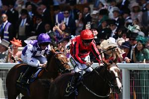 Jockey Paul Hanagan (R) riding The Ridler wins the Norfolk Stakes race during the third day, known as the Lady