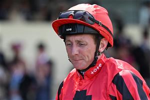 Jockey Paul Hanagan celebrates after wining, with The Ridler, the Norfolk Stakes race during the third day, known as the Lady