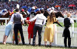 ASCOT, ENGLAND - JUNE 16: Racegoers watch on as Secret State (Blue + white cap) ridden by William Buick wins the King George V Stakes on Day Three of Royal Ascot 2022 at Ascot Racecourse on June 16, 2022 in Ascot, England. (Photo by Ryan Pierse/Getty Images)