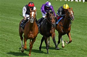 Jockey Ryan Moore rides Kyprios (L) to victory over Rossa Ryan on Mojo Star (C) and Frankie Dettori on Stradivarius (R) in the Gold Cup on the third day, known as the Lady