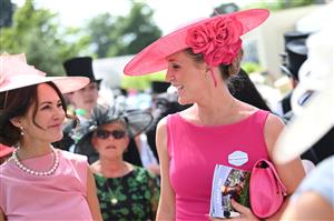 ASCOT, ENGLAND - JUNE 16: Racegoers wearing sarees place bets during Royal Ascot 2022 at Ascot Racecourse on June 16, 2022 in Ascot, England. (Photo by Eamonn M. McCormack/Getty Images for Ascot Racecourse)