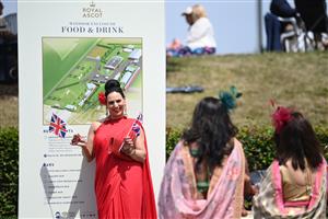 ASCOT, ENGLAND - JUNE 16: Racegoers wearing sarees pose for photographs during Royal Ascot 2022 at Ascot Racecourse on June 16, 2022 in Ascot, England. (Photo by Eamonn M. McCormack/Getty Images for Ascot Racecourse)