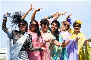 ASCOT, ENGLAND - JUNE 16: Racegoers wearing sarees pose for photographs during Royal Ascot 2022 at Ascot Racecourse on June 16, 2022 in Ascot, England. (Photo by Eamonn M. McCormack/Getty Images for Ascot Racecourse)
