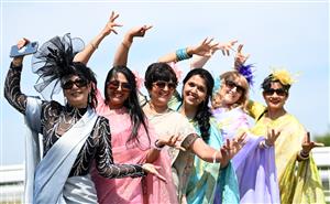 ASCOT, ENGLAND - JUNE 16: Racegoers wearing sarees pose for photographs during Royal Ascot 2022 at Ascot Racecourse on June 16, 2022 in Ascot, England. (Photo by Eamonn M. McCormack/Getty Images for Ascot Racecourse)