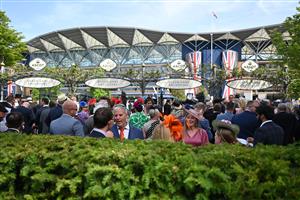 Racegoers socialize ahead of racing on the fourth day of the Royal Ascot horse racing meeting, in Ascot, west of London on June 17, 2022. (Photo by Justin TALLIS / AFP) (Photo by JUSTIN TALLIS/AFP via Getty Images)
