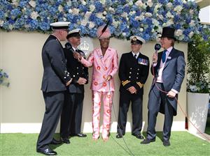 ASCOT, ENGLAND - JUNE 17: Susan Bender Whitfield and Scott Wimsett interview Officers of the Royal Navy on what is unofficially known as “Armed Forces Day” during Royal Ascot 2022 at Ascot Racecourse on June 17, 2022 in Ascot, England. (Photo by Kirstin Sinclair/Getty Images for Royal Ascot)