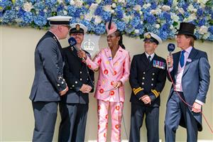 ASCOT, ENGLAND - JUNE 17: Susan Bender Whitfield and Scott Wimsett interview Officers of the Royal Navy on what is unofficially known as “Armed Forces Day” during Royal Ascot 2022 at Ascot Racecourse on June 17, 2022 in Ascot, England. (Photo by Kirstin Sinclair/Getty Images for Royal Ascot)