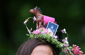 ASCOT, ENGLAND - JUNE 18: A racegoer with a horse hat arrives on day five of Royal Ascot 2022 at Ascot Racecourse on June 18, 2022 in Ascot, England. (Photo by Alex Livesey/Getty Images)