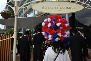 Racegoers arrive in the Royal Enclosure ahead of racing on the final day of the Royal Ascot horse racing meeting, in Ascot, west of London on June 18, 2022. (Photo by JUSTIN TALLIS / AFP) (Photo by JUSTIN TALLIS/AFP via Getty Images)