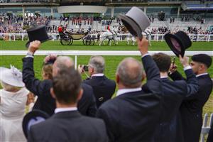 ASCOT, ENGLAND - JUNE 18: A general view of racegoers as the royal procession makes its way down the course during Royal Ascot 2022 at Ascot Racecourse on June 18, 2022 in Ascot, England. (Photo by Alan Crowhurst/Getty Images)