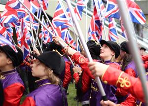 ASCOT, ENGLAND - JUNE 18: Union Jacks are waved during Royal Ascot 2022 at Ascot Racecourse on June 18, 2022 in Ascot, England. (Photo by Ryan Pierse/Getty Images)