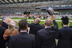ASCOT, ENGLAND - JUNE 18: A general view of racegoers as the royal procession makes its way down the course during Royal Ascot 2022 at Ascot Racecourse on June 18, 2022 in Ascot, England. (Photo by Alan Crowhurst/Getty Images)
