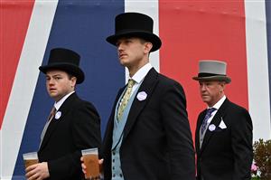 Racegoers take refreshments ahead of racing on the final day of the Royal Ascot horse racing meeting, in Ascot, west of London on June 18, 2022. (Photo by JUSTIN TALLIS / AFP) (Photo by JUSTIN TALLIS/AFP via Getty Images)
