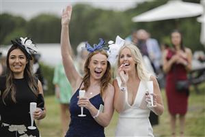 ASCOT, ENGLAND - JUNE 18: Racegoers enjoying refreshments in the Windsor Enclosure during Royal Ascot 2022 at Ascot Racecourse on June 18, 2022 in Ascot, England. (Photo by John Phillips/Getty Images for Ascot Racecourse)