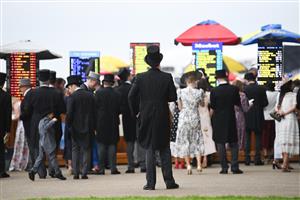ASCOT, ENGLAND - JUNE 18: Racegoers placing bets during Royal Ascot 2022 at Ascot Racecourse on June 18, 2022 in Ascot, England. (Photo by Eamonn M. McCormack/Getty Images for Ascot Racecourse)