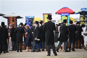 ASCOT, ENGLAND - JUNE 18: Racegoers placing bets during Royal Ascot 2022 at Ascot Racecourse on June 18, 2022 in Ascot, England. (Photo by Eamonn M. McCormack/Getty Images for Ascot Racecourse)