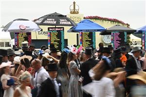 ASCOT, ENGLAND - JUNE 18: Racegoers outside the betting stands during Royal Ascot 2022 at Ascot Racecourse on June 18, 2022 in Ascot, England. (Photo by Eamonn M. McCormack/Getty Images for Ascot Racecourse)