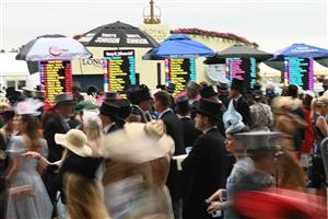 ASCOT, ENGLAND - JUNE 18: Racegoers outside the betting stands during Royal Ascot 2022 at Ascot Racecourse on June 18, 2022 in Ascot, England. (Photo by Eamonn M. McCormack/Getty Images for Ascot Racecourse)