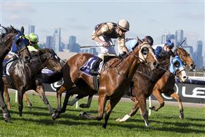 MELBOURNE, AUSTRALIA - JUNE 18: Billy Egan riding Nasraawy winning Race 2, the Country Racing Victoria Handicap, during Melbourne Racing at Flemington Racecourse on June 18, 2022 in Melbourne, Australia. (Photo by Vince Caligiuri/Getty Images)