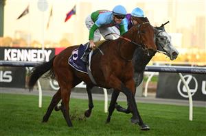 MELBOURNE, AUSTRALIA - JUNE 18: Jarrod Fry riding Tuvalu winning Race 8, the The David Bourke, during Melbourne Racing at Flemington Racecourse on June 18, 2022 in Melbourne, Australia. (Photo by Vince Caligiuri/Getty Images)