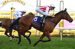 MELBOURNE, AUSTRALIA - JUNE 18: Jordan Childs riding Passive Aggressive defeats Brett Prebble riding Star Patrol in Race 5, the A.r. Creswick Stakes, during Melbourne Racing at Flemington Racecourse on June 18, 2022 in Melbourne, Australia. (Photo by Vince Caligiuri/Getty Images)
