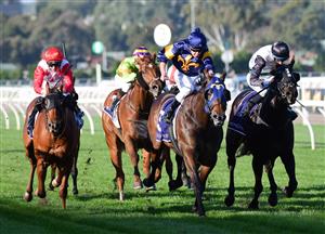 MELBOURNE, AUSTRALIA - JUNE 18: Michael Dee riding Biometric (r) winning Race 6, the Brian Beattie Handicap, during Melbourne Racing at Flemington Racecourse on June 18, 2022 in Melbourne, Australia. (Photo by Vince Caligiuri/Getty Images)