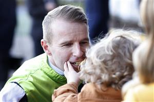 SYDNEY, AUSTRALIA - JUNE 18: Tommy Berry greets son Nate after winning race 9 the Robert Patricks Handicap on Bella Rouge during Sydney Racing at Rosehill Gardens on June 18, 2022 in Sydney, Australia. (Photo by Mark Evans/Getty Images)