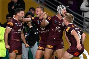 BRISBANE, AUSTRALIA - JULY 13: Ben Hunt of the Maroons celebrates with teammates after scoring the match winning try during game three of the State of Origin Series between the Queensland Maroons and the New South Wales Blues at Suncorp Stadium on July 13, 2022 in Brisbane, Australia. (Photo by Bradley Kanaris/Getty Images)