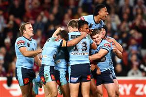 BRISBANE, AUSTRALIA - JULY 13: Jacob Saifiti of the Blues celebrates with team mates after scoring a try during game three of the State of Origin Series between the Queensland Maroons and the New South Wales Blues at Suncorp Stadium on July 13, 2022, in Brisbane, Australia. (Photo by Chris Hyde/Getty Images)