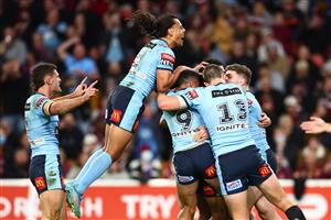 BRISBANE, AUSTRALIA - JULY 13: Jarome Luai of the Blues celebrates with Jacob Saifiti of the Blues after he scored a try during game three of the State of Origin Series between the Queensland Maroons and the New South Wales Blues at Suncorp Stadium on July 13, 2022, in Brisbane, Australia. (Photo by Chris Hyde/Getty Images)
