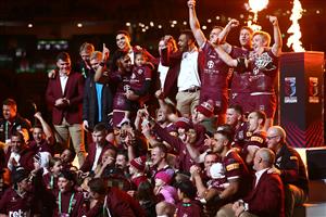 BRISBANE, AUSTRALIA - JULY 13: Daly Cherry-Evans of the Maroons poses with the State of Origin Shield and celebrates with team mate after winning game three of the State of Origin Series between the Queensland Maroons and the New South Wales Blues at Suncorp Stadium on July 13, 2022, in Brisbane, Australia. (Photo by Chris Hyde/Getty Images)