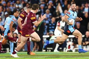BRISBANE, AUSTRALIA - JULY 13: James Tedesco of the Blues makes a break during game three of the State of Origin Series between the Queensland Maroons and the New South Wales Blues at Suncorp Stadium on July 13, 2022, in Brisbane, Australia. (Photo by Chris Hyde/Getty Images)
