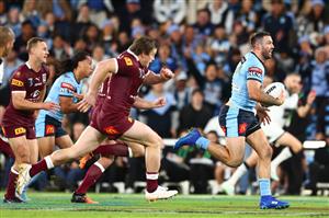 BRISBANE, AUSTRALIA - JULY 13: James Tedesco of the Blues makes a break during game three of the State of Origin Series between the Queensland Maroons and the New South Wales Blues at Suncorp Stadium on July 13, 2022, in Brisbane, Australia. (Photo by Chris Hyde/Getty Images)