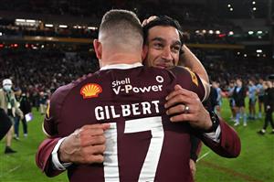 BRISBANE, AUSTRALIA - JULY 13: Tom Gilbert of the Maroons embraces Johnathan Thurston after game three of the State of Origin Series between the Queensland Maroons and the New South Wales Blues at Suncorp Stadium on July 13, 2022 in Brisbane, Australia. (Photo by Bradley Kanaris/Getty Images)