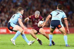 BRISBANE, AUSTRALIA - JULY 13: Kalyn Ponga of the Maroons is tackled during game three of the State of Origin Series between the Queensland Maroons and the New South Wales Blues at Suncorp Stadium on July 13, 2022, in Brisbane, Australia. (Photo by Chris Hyde/Getty Images)